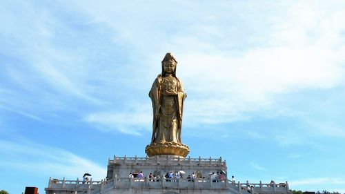 Low angle view of statue against sky