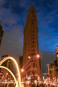 Low angle view of skyscrapers lit up at night