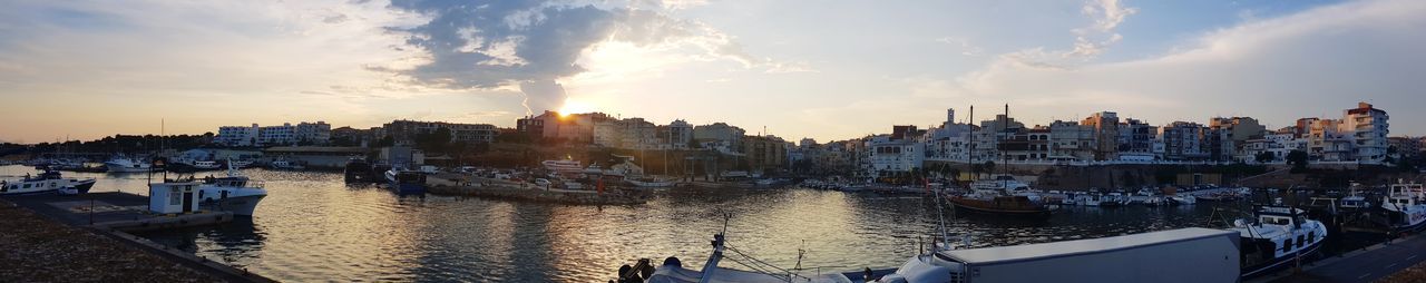 Panoramic view of buildings against sky during sunset