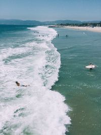 Scenic view of sea against sky during sunny day