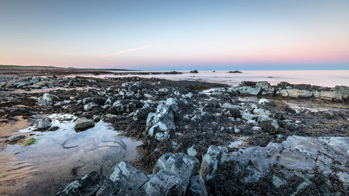 Scenic view of sea against sky during sunset