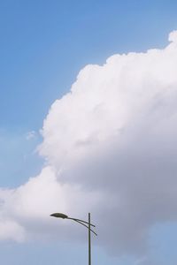 Low angle view of street light against sky