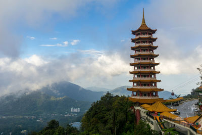 View of temple against cloudy sky