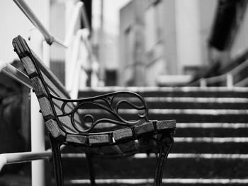 Close-up of empty chairs on table