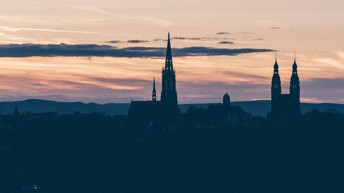 Silhouette of building at sunset