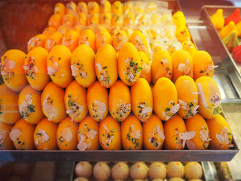 High angle view of sweet food in container for sale at shop