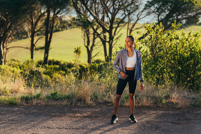 Full length of woman standing on field