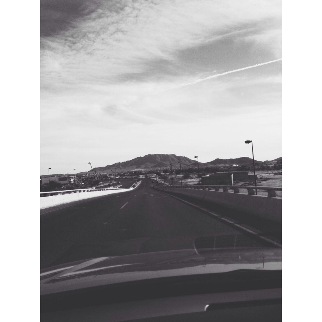 transfer print, transportation, sky, auto post production filter, road, cloud - sky, the way forward, car, mode of transport, road marking, cloud, diminishing perspective, vehicle interior, land vehicle, vanishing point, glass - material, no people, street, on the move, windshield