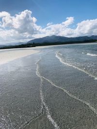 Scenic view of beach against sky