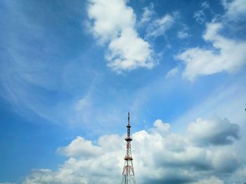 Low angle view of communications tower against sky