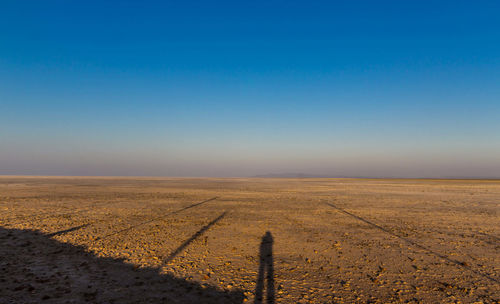 Scenic view of desert against clear sky