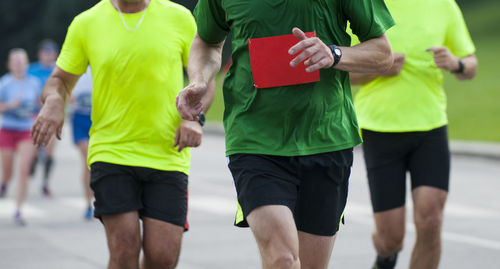 Midsection of runner running marathon