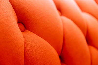 Background of orange velvet sofa