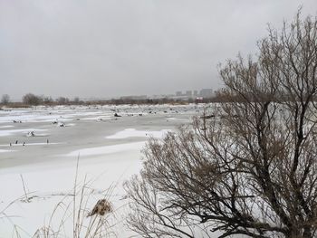 Scenic view of frozen lake against sky