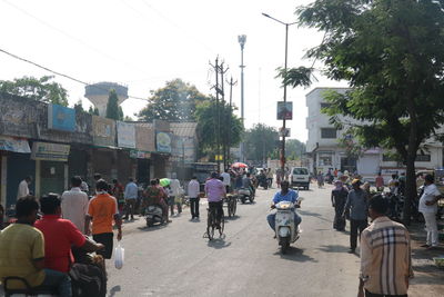 Group of people walking on city street