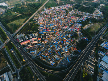 High angle view of commercial dock and buildings in city