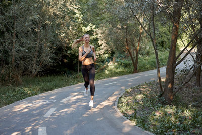Full length of man running on road