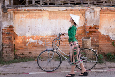 Side view of a bicycle against wall