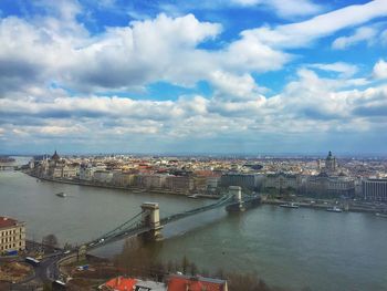 Cityscape against cloudy sky