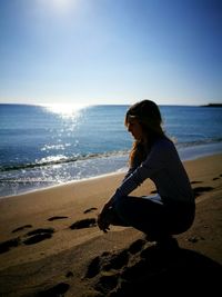 Woman sitting on beach