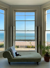 View of sea through window