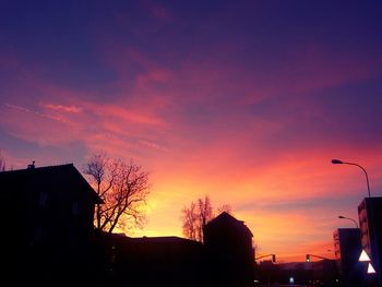 Low angle view of building against sky at sunset