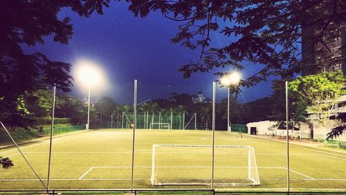 View of soccer field against sky at night