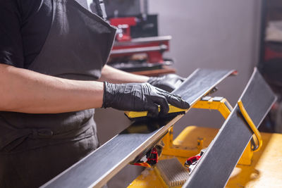 Man working on escalator