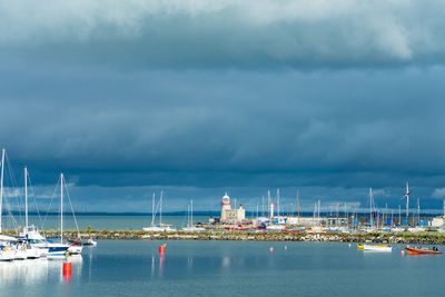 Boats in sea against sky