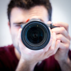 Close-up portrait of man photographing