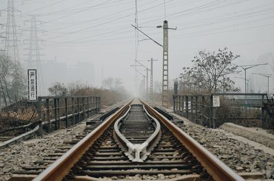 Railroad tracks against clear sky