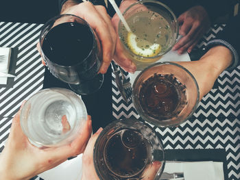 Cropped image of hands holding drink