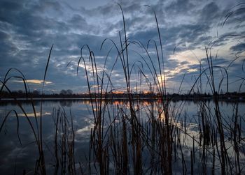 Scenic view of lake against sky during sunset