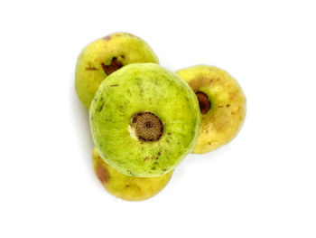 Close-up of fruits against white background