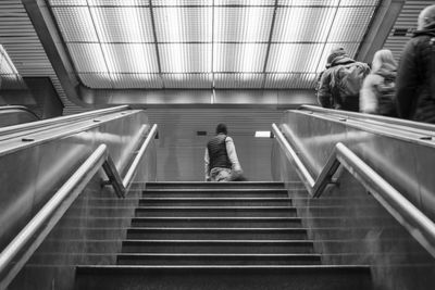 Rear view of man locked between stairs.