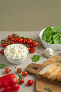 Mozzarella salad ingredients on colored background