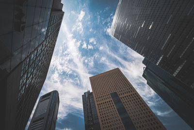 Low angle view of modern buildings against sky