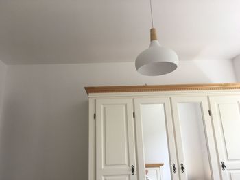 Low angle view of pendant light hanging from ceiling