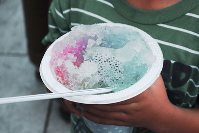 Close-up of hand holding cold drink