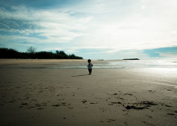 Full length of man on beach against sky