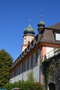 Low angle view of building against blue sky