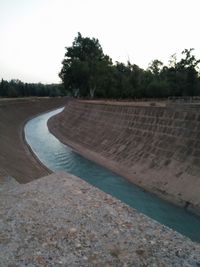 Scenic view of dam against sky