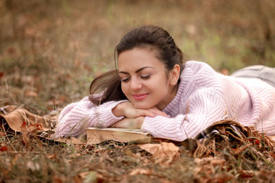 Young woman sitting on field