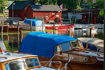 Rear view of man on boat moored at shore