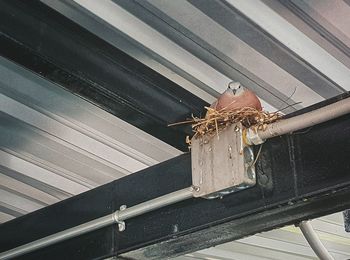 High angle view of rope tied on metal railing