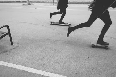 Low section of people walking on road