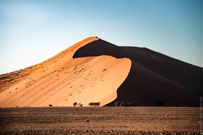 Scenic view of desert against clear sky