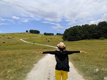 Hiker on mountain dirt road