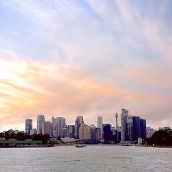 Skyscrapers in city at dusk