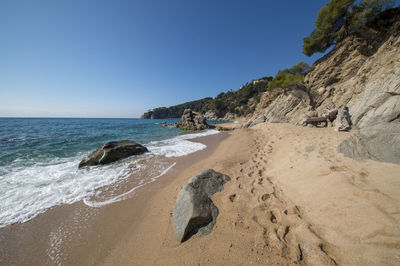 Scenic view of beach against clear sky